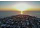 Aerial view of a residential neighborhood along the ocean at sunrise at 704 Gladiolus St, Anna Maria, FL 34216