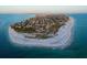 Expansive aerial view of a waterfront community featuring pristine beaches and stunning ocean views at 704 Gladiolus St, Anna Maria, FL 34216