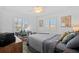 Inviting bedroom featuring a cozy queen bed, desk, and natural light at 704 Gladiolus St, Anna Maria, FL 34216