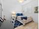 Bedroom with a desk, chair, and plantation shutters and beach themed decor at 704 Gladiolus St, Anna Maria, FL 34216