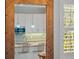 Charming kitchen view reflected in a wooden-framed mirror at 704 Gladiolus St, Anna Maria, FL 34216