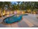 Inviting private pool area surrounded by lush tropical landscaping, perfect for relaxation and entertainment at 704 Gladiolus St, Anna Maria, FL 34216