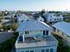 Enjoy ocean views from the rooftop deck of this charming coastal home, perfect for relaxing and entertaining at 704 Gladiolus St, Anna Maria, FL 34216