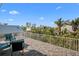 Spacious rooftop deck with outdoor seating and scenic views of lush neighborhood at 704 Gladiolus St, Anna Maria, FL 34216