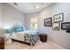 Inviting bedroom featuring a colorful rug, dresser, and a window that offers plenty of natural light at 7164 Rue De Palisades # 5, Sarasota, FL 34238