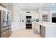 Modern kitchen with white cabinets, stainless steel appliances, and ample counter space at 7164 Rue De Palisades # 5, Sarasota, FL 34238
