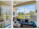 Covered lanai boasts comfortable seating and tranquil water views at 7164 Rue De Palisades # 5, Sarasota, FL 34238