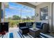 Spacious covered lanai offers comfortable seating and tranquil lake views at 7164 Rue De Palisades # 5, Sarasota, FL 34238