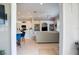 Wide shot of living space with breakfast nook, and kitchen connected to the living room in an open layout at 7164 Rue De Palisades # 5, Sarasota, FL 34238