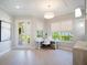 Bright office space with a white desk, natural light, and stylish decor at 7164 Rue De Palisades # 5, Sarasota, FL 34238
