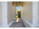Covered walkway featuring brick pavers and decorative columns at 7164 Rue De Palisades # 5, Sarasota, FL 34238