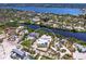 Luxury waterfront property with modern house, green space and private beach access surrounded by tropical nature at 7647 Sanderling Rd, Sarasota, FL 34242