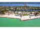 Aerial view of a luxury home nestled on a waterfront property with a private beach at 7647 Sanderling Rd, Sarasota, FL 34242