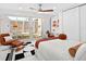 Comfortable bedroom with sliding glass doors to a private outdoor space and stylish decor at 7647 Sanderling Rd, Sarasota, FL 34242