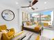 Stylish bedroom featuring a queen bed, a ceiling fan, and access to a private outdoor area at 7647 Sanderling Rd, Sarasota, FL 34242