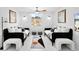 Bright bedroom featuring two daybeds, decorative lighting, stylish art, and cozy decor at 7647 Sanderling Rd, Sarasota, FL 34242