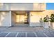 Modern home entrance with minimalist design, textured walkway, and decorative potted plants at 7647 Sanderling Rd, Sarasota, FL 34242