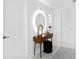 Sleek entryway with a modern lit mirror, stylish console table, and minimalist decor at 7647 Sanderling Rd, Sarasota, FL 34242