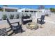 Inviting fire pit area with Adirondack chairs, perfect for cozy outdoor gatherings at 7647 Sanderling Rd, Sarasota, FL 34242
