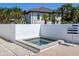 Private hot tub with a modern design, perfect for relaxation and enjoying the outdoor space at 7647 Sanderling Rd, Sarasota, FL 34242
