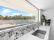Bright kitchen sink area offers a scenic view of the outdoor pool and lush landscaping at 7647 Sanderling Rd, Sarasota, FL 34242