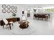 Open-concept layout with a dining area and living room, featuring modern decor and ample natural light at 7647 Sanderling Rd, Sarasota, FL 34242