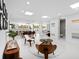 Open-concept layout with a dining area and living room, featuring modern decor and ample natural light at 7647 Sanderling Rd, Sarasota, FL 34242