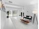 Bright living room showcasing a modern design with minimalist furniture and unique decorative art at 7647 Sanderling Rd, Sarasota, FL 34242