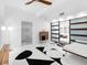 A modern living room with an open layout, contemporary furniture, and ample natural light at 7647 Sanderling Rd, Sarasota, FL 34242