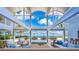 Bright living room with ocean view, featuring coastal decor, high ceilings, and an open design at 7647 Sanderling Rd, Sarasota, FL 34242