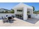 Outdoor kitchen area with a dining set, perfect for entertaining at 7647 Sanderling Rd, Sarasota, FL 34242