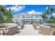 Elegant outdoor seating area with comfortable furniture, perfect for entertaining guests in style at 7647 Sanderling Rd, Sarasota, FL 34242