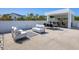 Spacious outdoor area featuring a dining space, lounge area, and bar, ideal for entertaining at 7647 Sanderling Rd, Sarasota, FL 34242