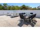 Outdoor patio with modern furniture and a dining table, perfect for entertaining guests at 7647 Sanderling Rd, Sarasota, FL 34242