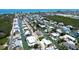 Scenic aerial view of neighborhood canals near the beach showing the home with a screened-in pool at 791 Saint Judes Dr N, Longboat Key, FL 34228