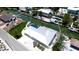 Overhead view showcases the home’s roof and screened-in pool near the canal at 791 Saint Judes Dr N, Longboat Key, FL 34228