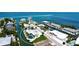 Stunning aerial view of waterfront property with screened pool on canal; quick access to Intracoastal Waterway at 791 Saint Judes Dr N, Longboat Key, FL 34228