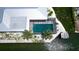 Overhead view of the house with a screened-in pool, dock, and surrounding waterfront landscape at 791 Saint Judes Dr N, Longboat Key, FL 34228