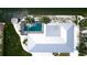 Aerial view of screened pool, backyard, with dock and waterway views at 791 Saint Judes Dr N, Longboat Key, FL 34228