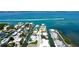 Beautiful aerial view of waterfront home with pool on canal with access to Intracoastal Waterway at 791 Saint Judes Dr N, Longboat Key, FL 34228