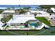 Waterfront home with private dock and screened pool, perfect for outdoor enjoyment at 791 Saint Judes Dr N, Longboat Key, FL 34228