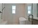 Modern bathroom featuring a soaking tub, walk-in shower with glass door and vanity at 791 Saint Judes Dr N, Longboat Key, FL 34228