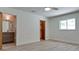 Bedroom with a window, walk-in closet and view of the en suite bathroom at 791 Saint Judes Dr N, Longboat Key, FL 34228