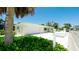 Beautiful home featuring a freshly painted exterior, white stone landscaping, and a two-car garage at 791 Saint Judes Dr N, Longboat Key, FL 34228