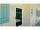Close up of home entrance showing front door, exterior light and house number at 791 Saint Judes Dr N, Longboat Key, FL 34228