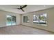 Bright living room featuring tile flooring and view of the pool at 791 Saint Judes Dr N, Longboat Key, FL 34228