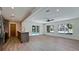Open-concept living space with modern kitchen, and a view of the pool at 791 Saint Judes Dr N, Longboat Key, FL 34228