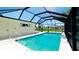 View of screened pool with view of backyard at 791 Saint Judes Dr N, Longboat Key, FL 34228