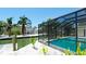 View of screened pool and waterfront from the backyard, showcasing its proximity to the channel at 791 Saint Judes Dr N, Longboat Key, FL 34228
