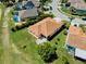 Aerial view of the property featuring a spacious yard, mature trees, and a screened-in lanai for outdoor enjoyment at 834 Springwood Cir, Bradenton, FL 34212
